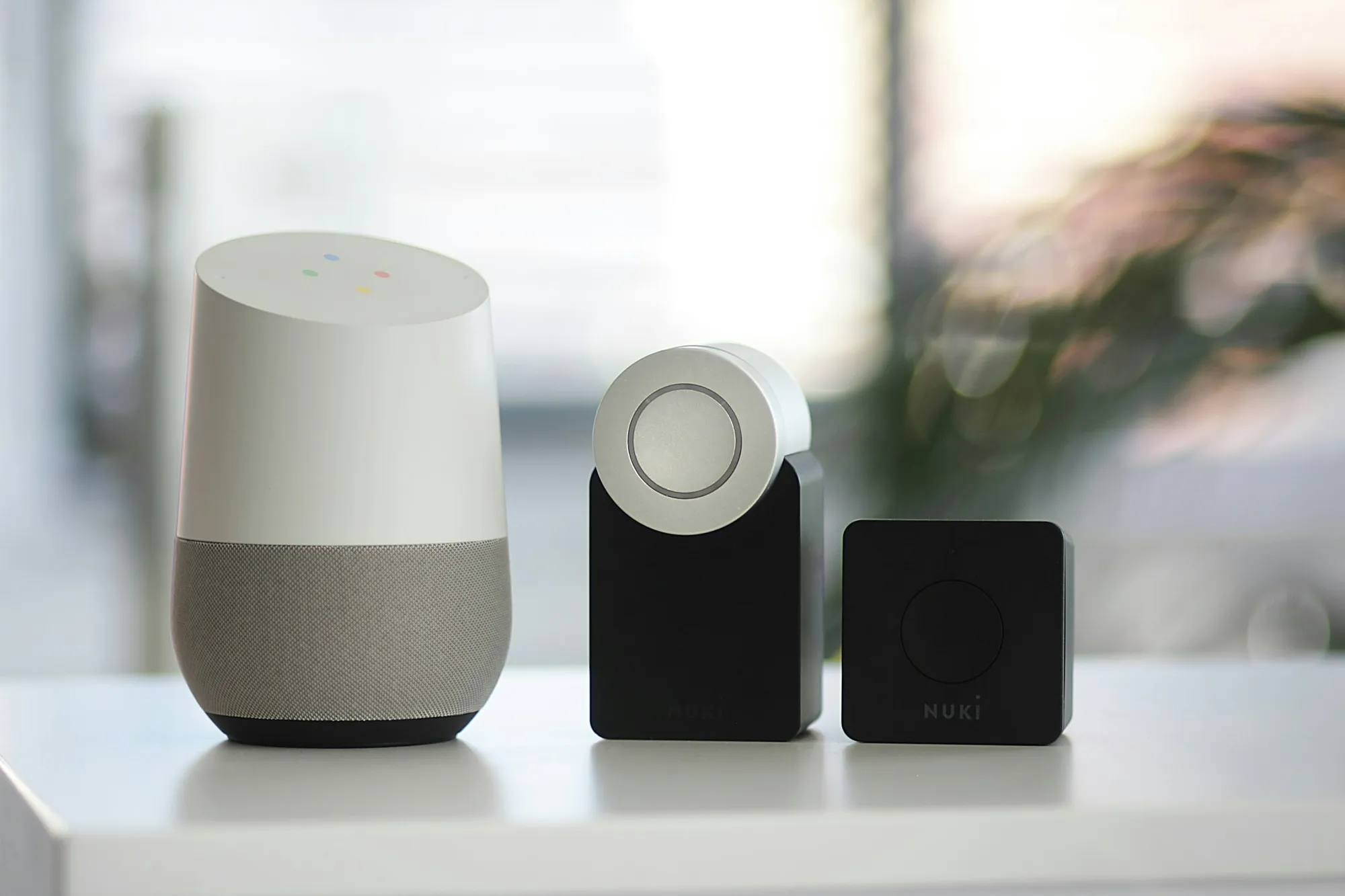 Smart home devices arranged on a shelf in a modern apartment