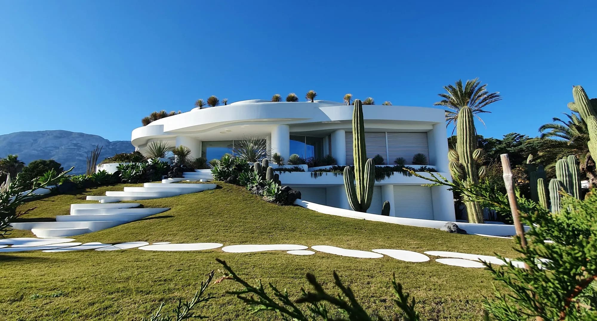 A bright coastal holiday house on a sunny day