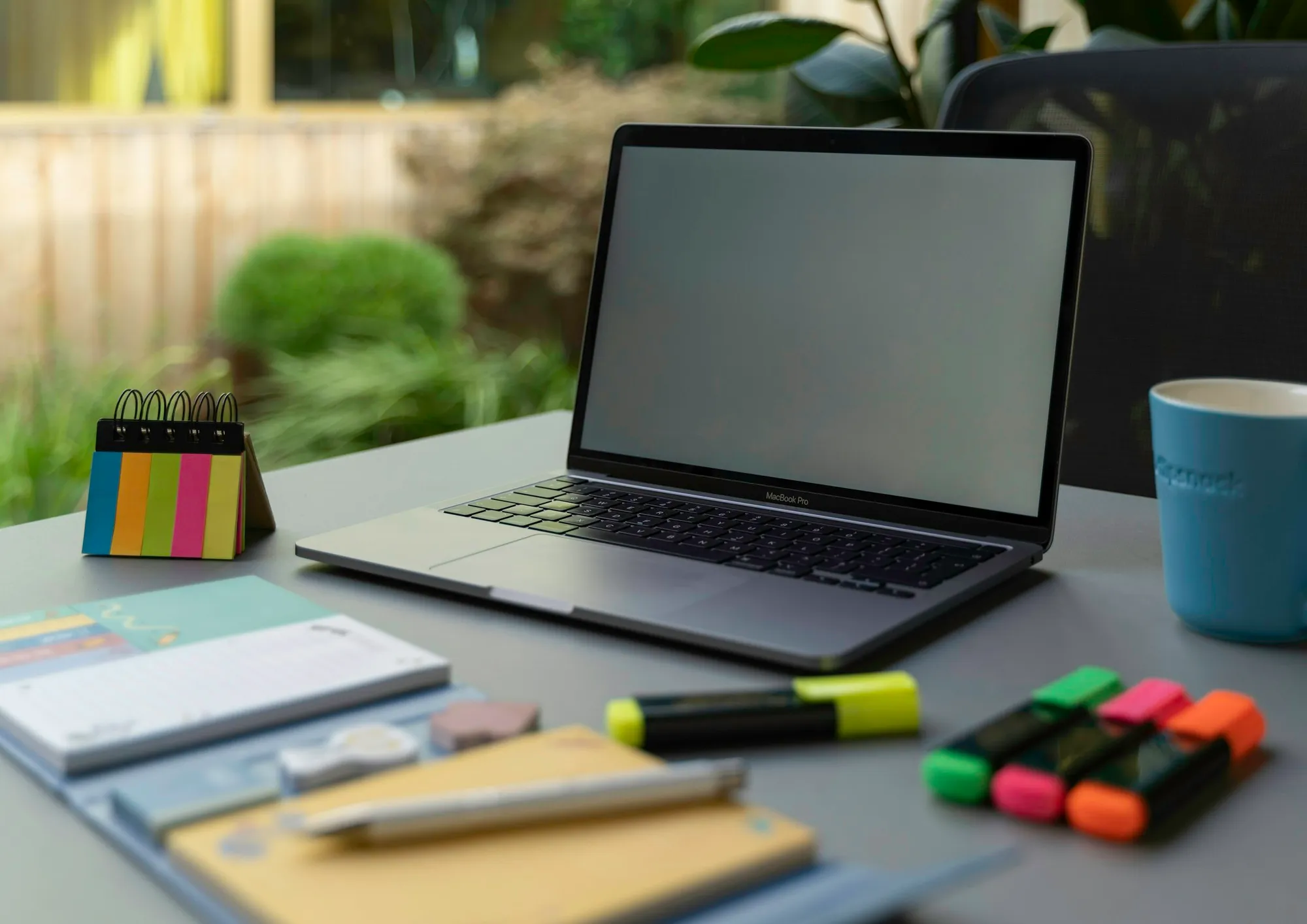 Sticky notes and a notebook on a planning desk