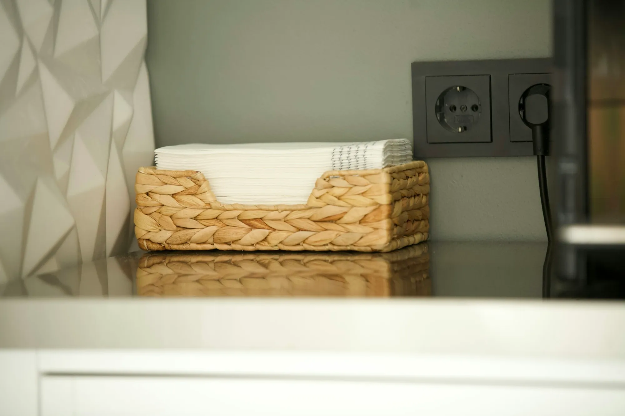 A welcome basket on a vacation rental kitchen counter