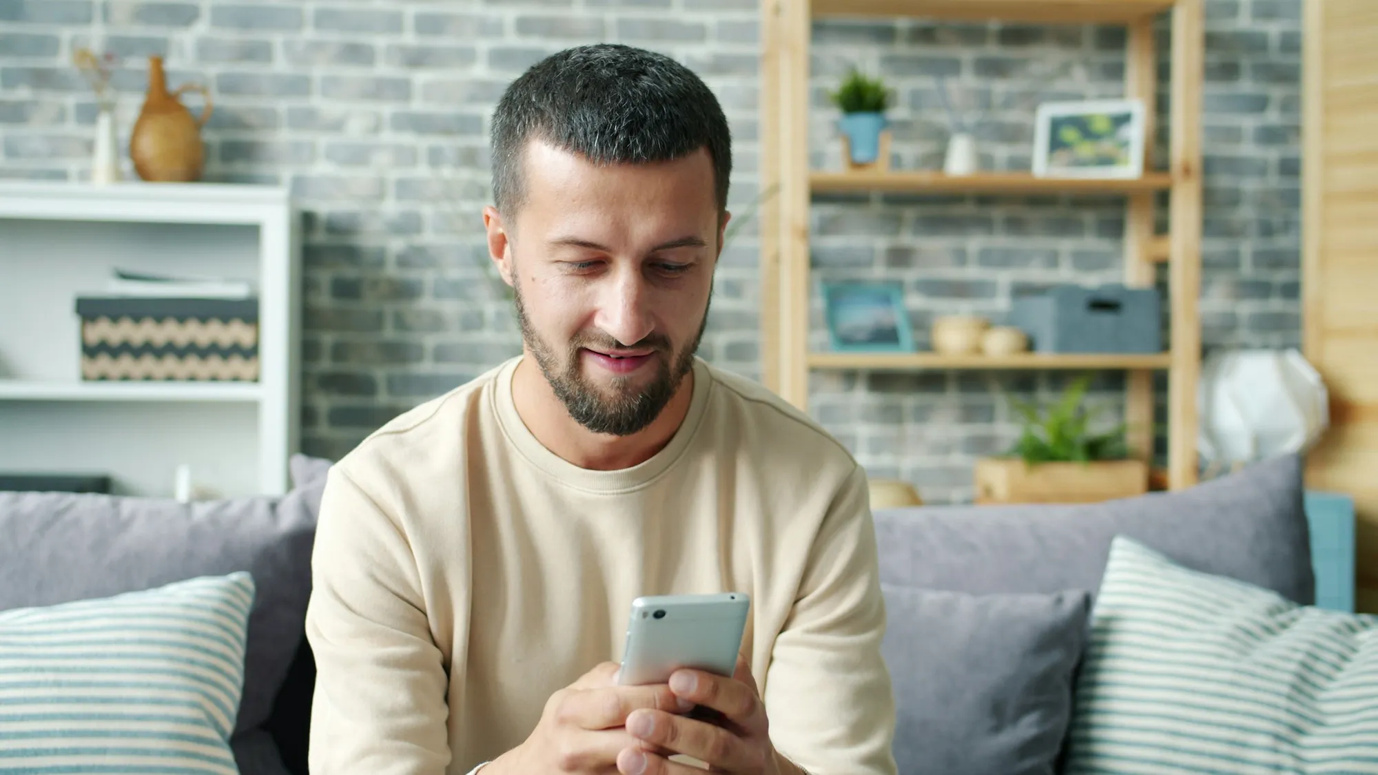 A phone being used to control devices in a living room