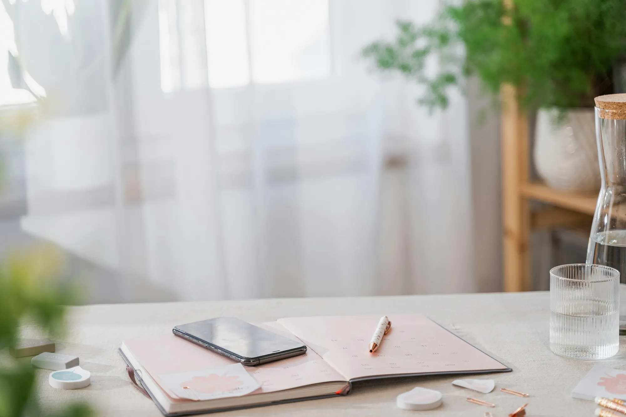 A smartphone on a table in a bright apartment