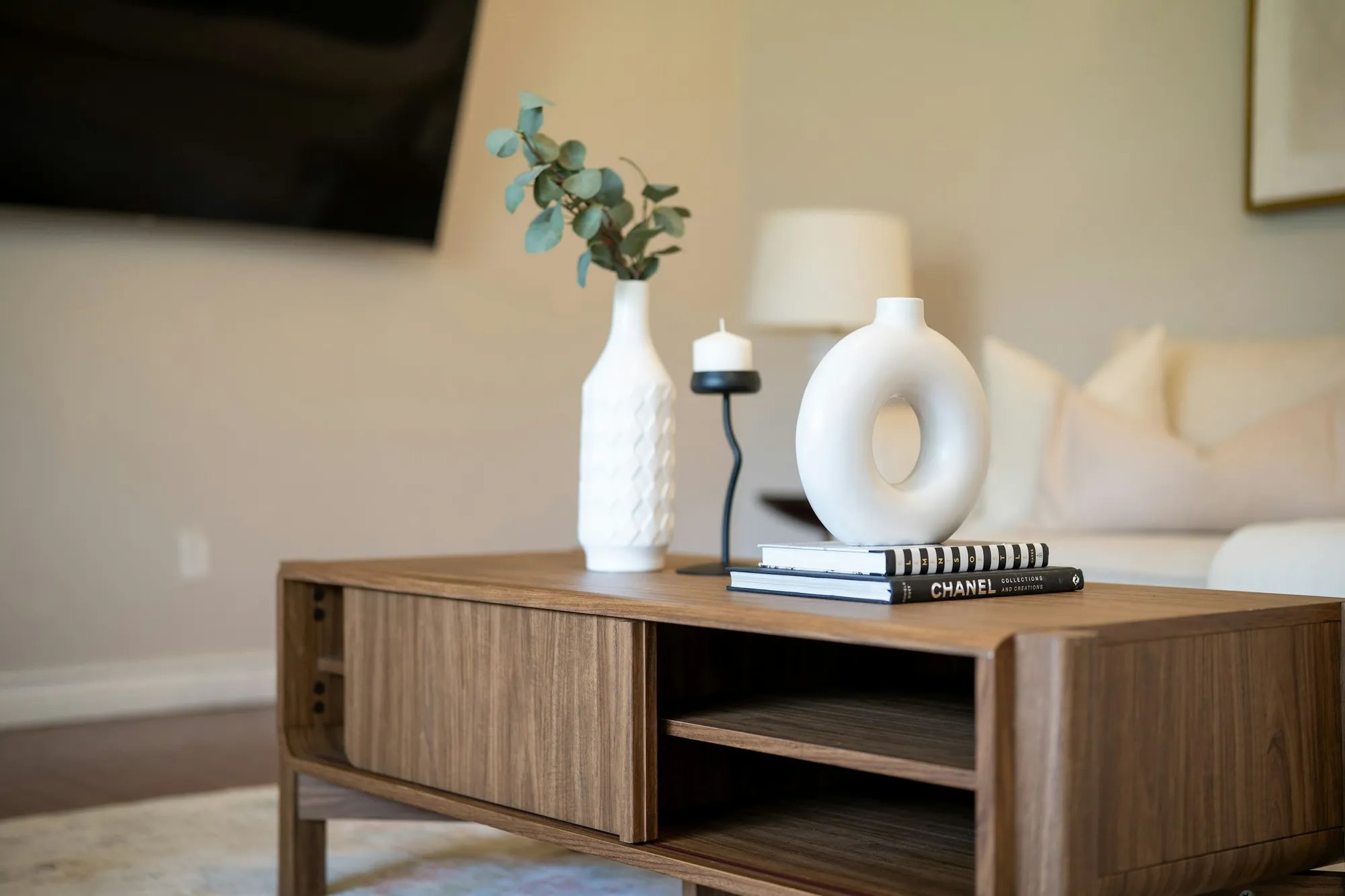 A notebook on a coffee table in a bright living room