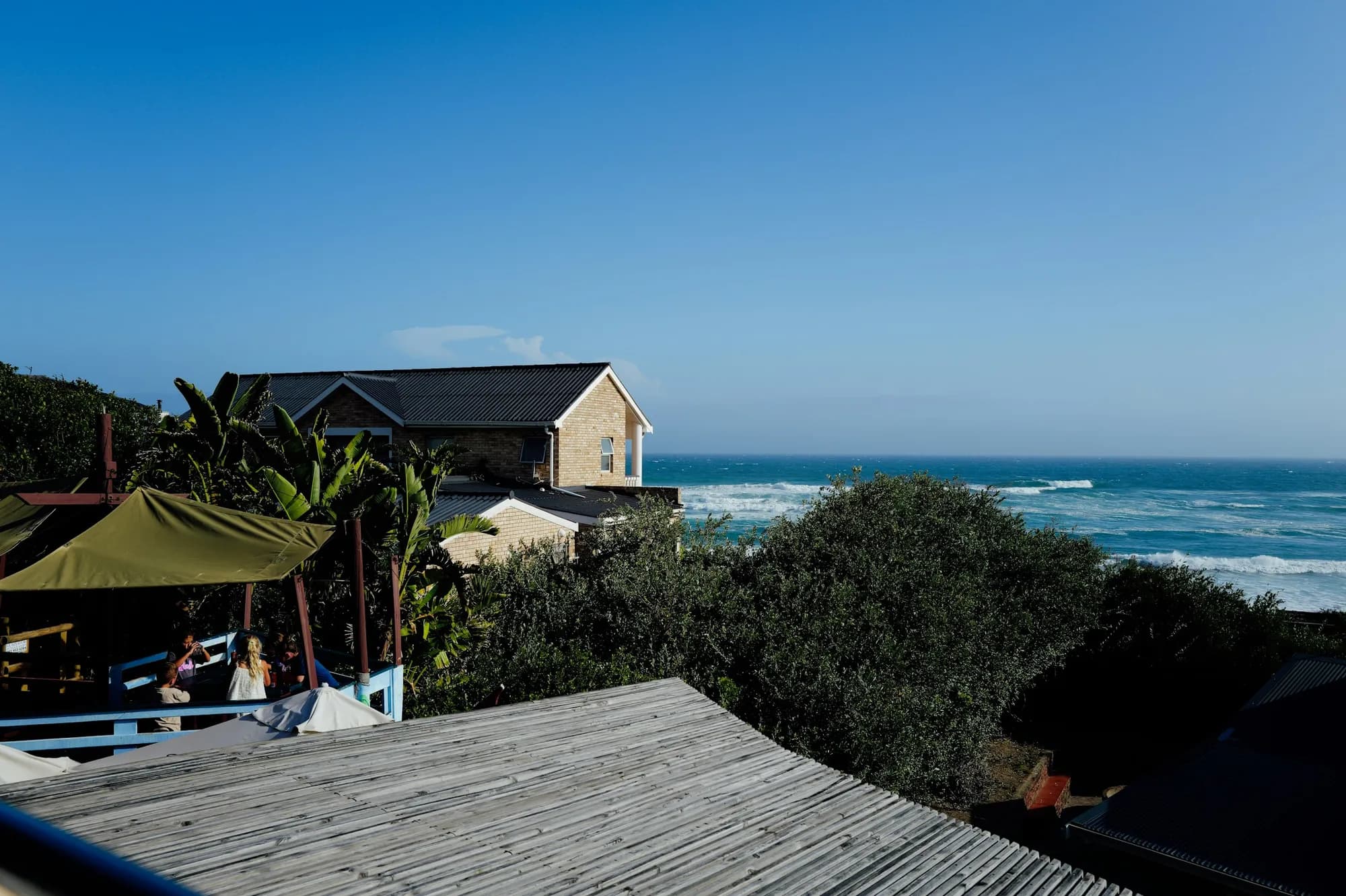 A holiday house balcony looking out over the sea
