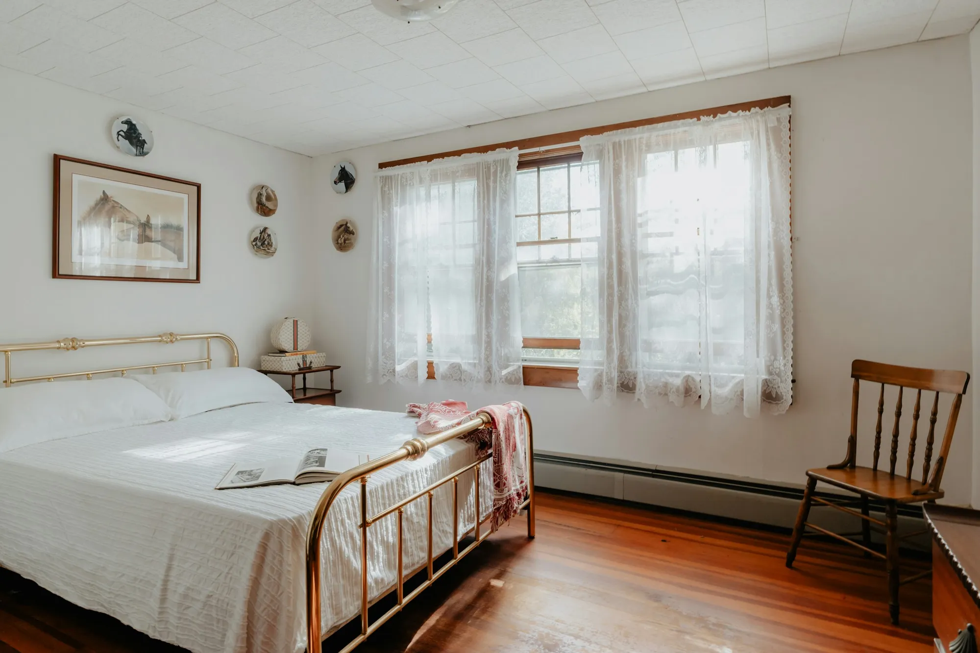 A spotless vacation rental bedroom with white bedding