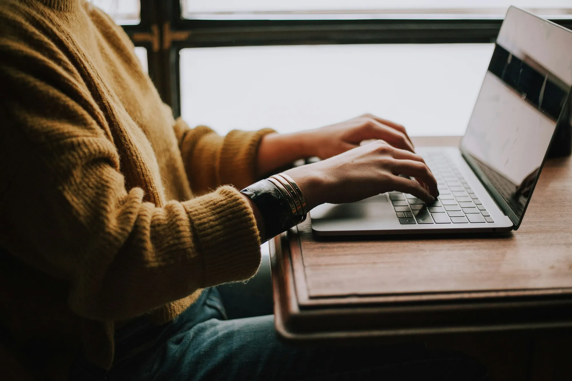 A laptop on a desk used for email marketing planning