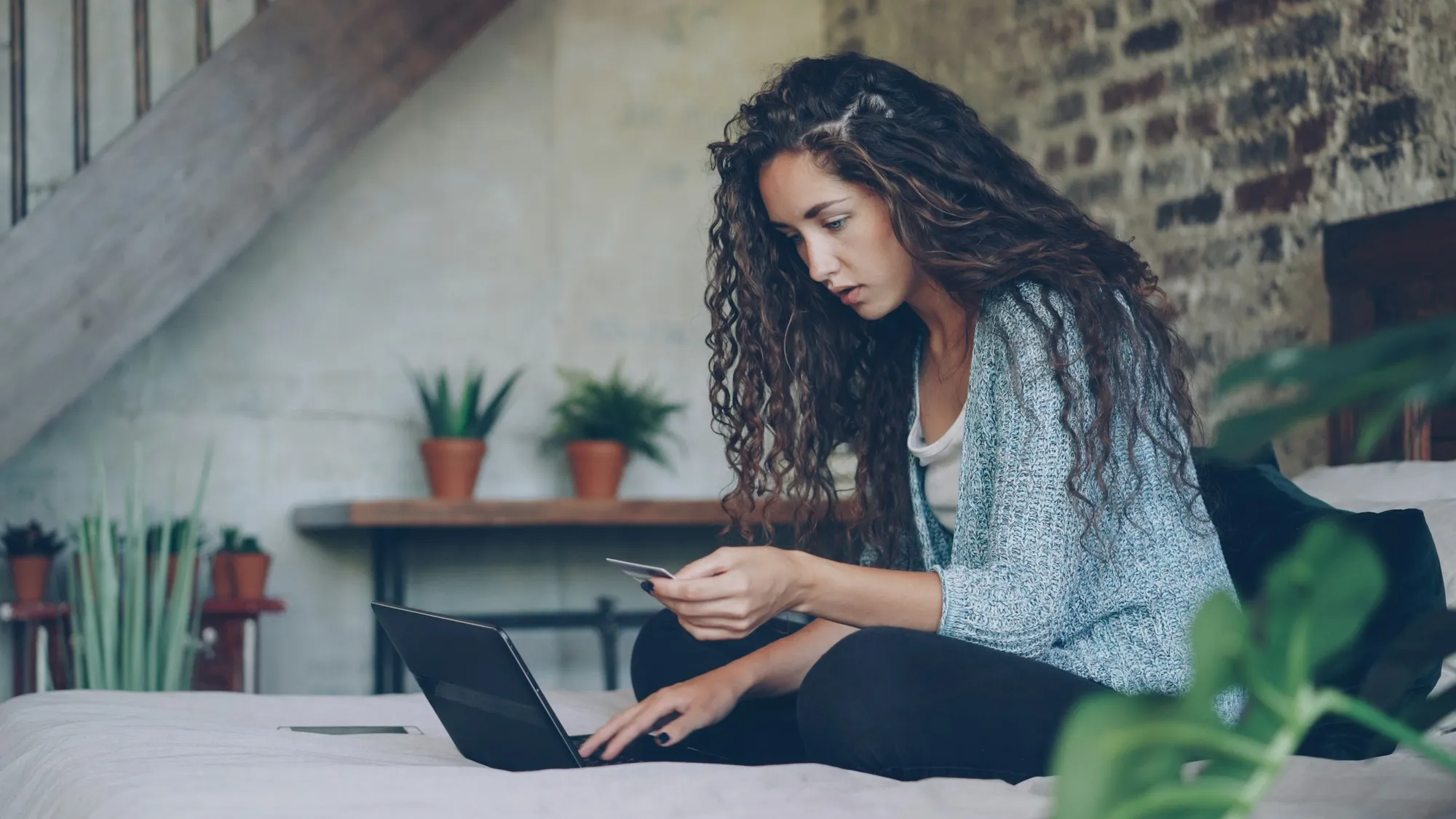 Someone booking accommodation on a laptop at home