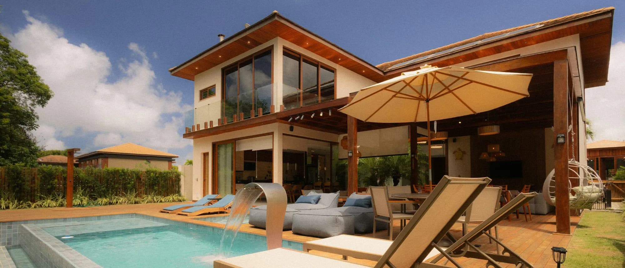 A sunny poolside patio at a vacation rental
