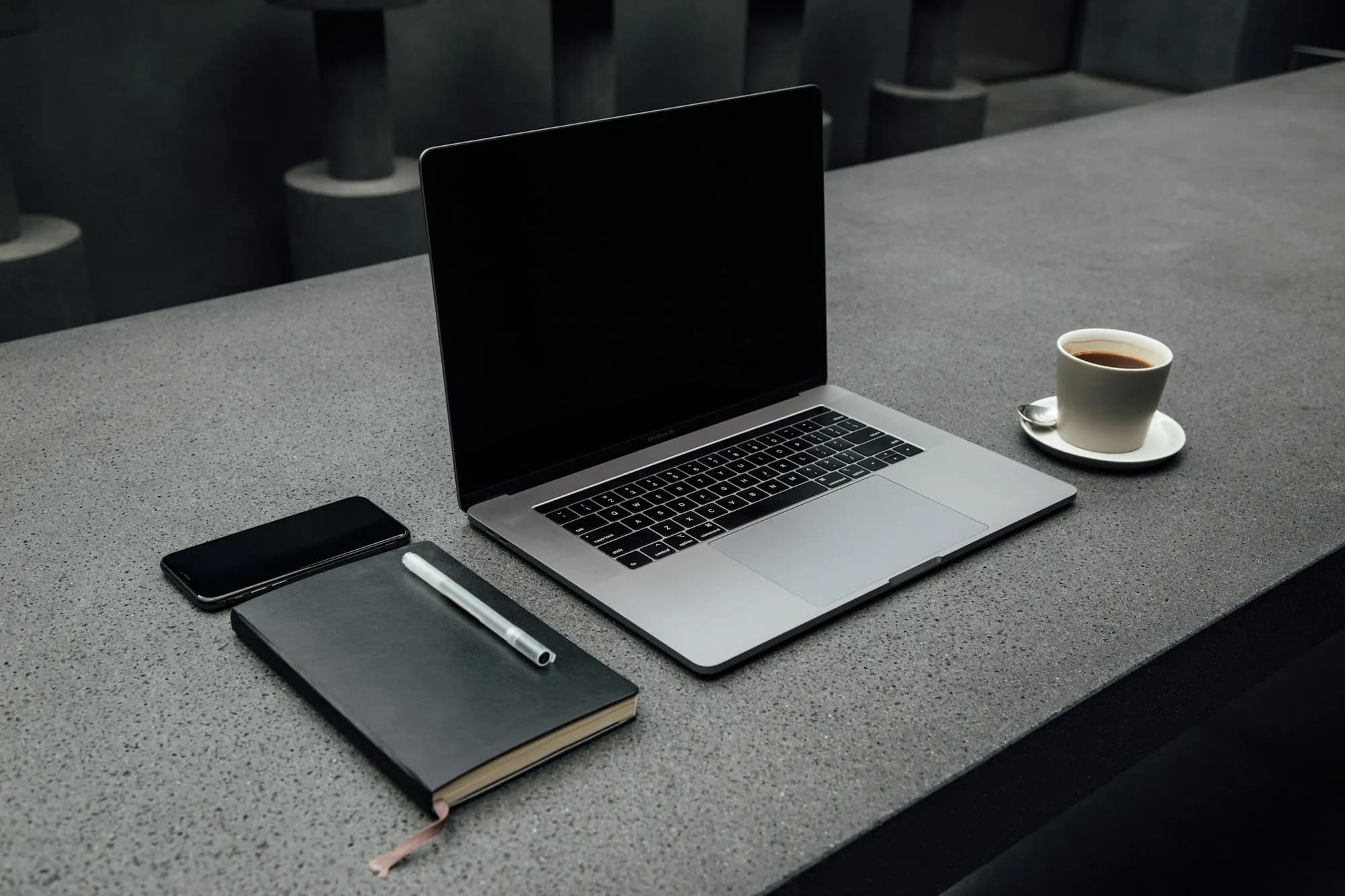 Coffee, a notebook and a laptop used for research notes